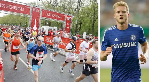 Läufer beim Berliner Halbmarathon in Deutschland. Rechts ein Fußballspieler im blauen Trikot.