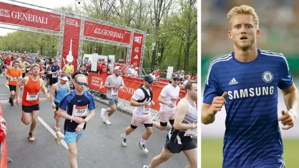 Läufer beim Berliner Halbmarathon in Deutschland. Rechts ein Fußballspieler im blauen Trikot.